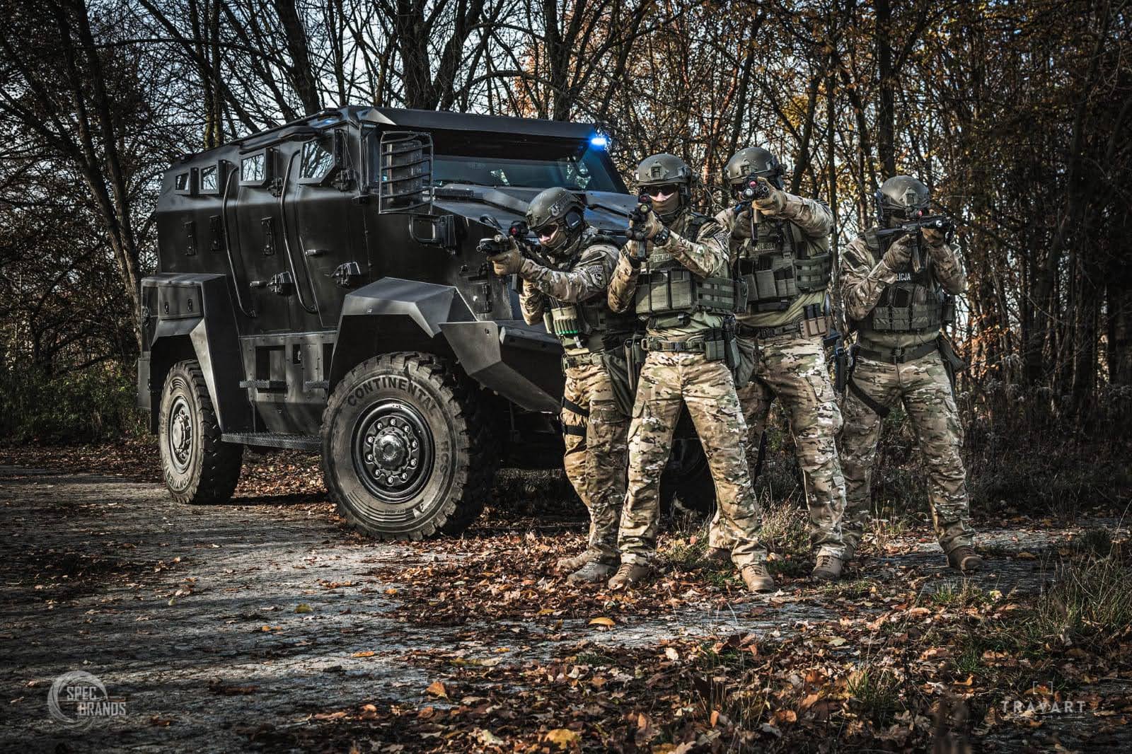 Tactical team in formation, dark, dramatic lighting